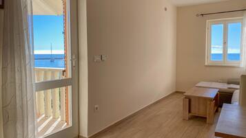 Apartment, Sea View (2) | Living area | Flat-screen TV