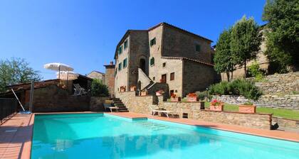 Ancient stone hamlet in an extremely panoramic position overlooking the wooded Val di Chio. Private