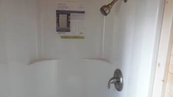 Shower, towels, soap, toilet paper