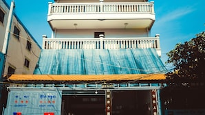 A multi-story building with a series of balconies. - Cambodia Eren Hotel (Phnom Penh)
