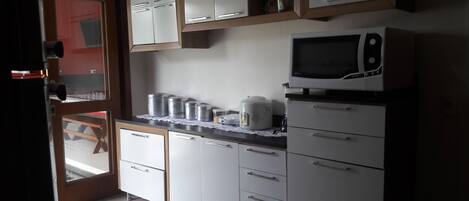 Fridge, microwave, stovetop, coffee/tea maker