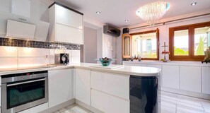 Villa | Private kitchen | Full-sized fridge, microwave, oven, stovetop - Stunning 3 bedroom villa 'JZ02' with private pool, beautiful interiors, communal pool and resort facilities, Zephyros Village, Aphrodite Hills (Kouklia)