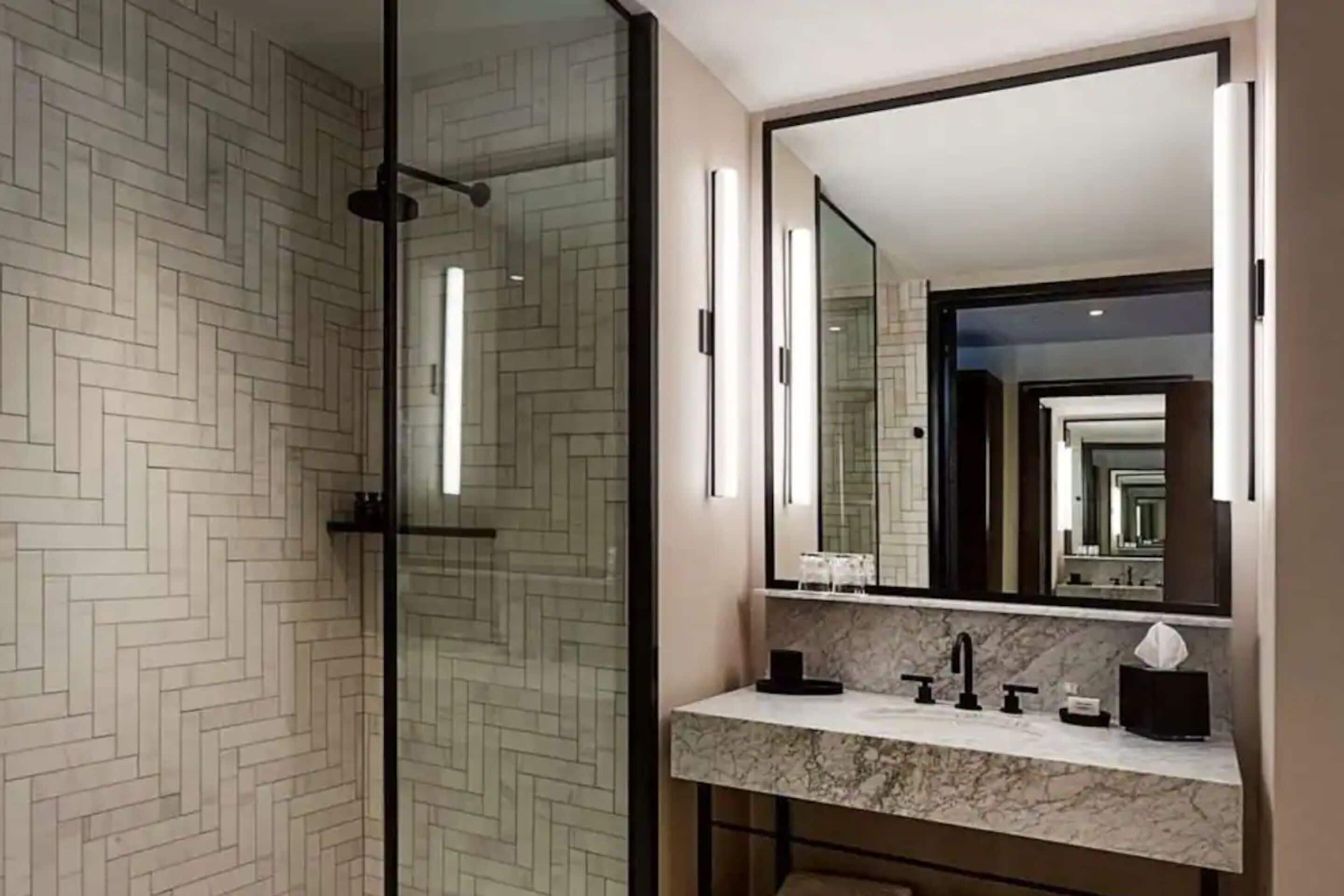 designer toiletries, hair dryer, towels, soap