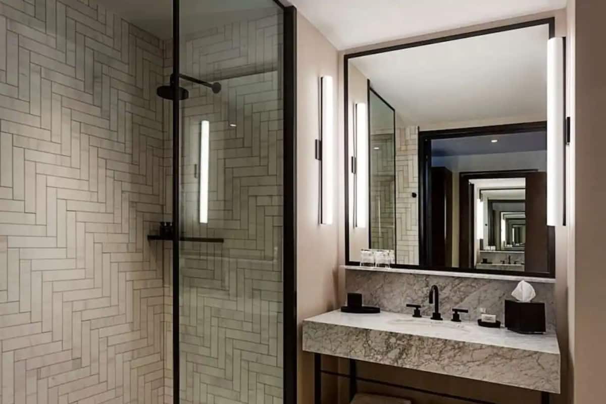 designer toiletries, hair dryer, towels, soap