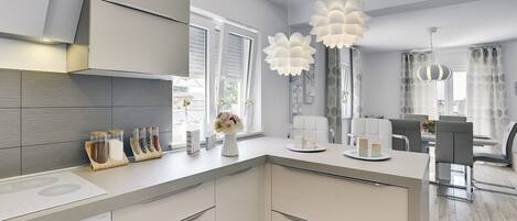 Een koelkast, een magnetron, een kookplaat, een vaatwasser