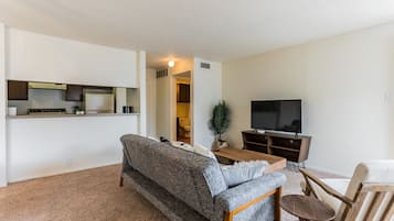 Luxury Condo, 1 Bedroom | Living area | 32-inch flat-screen TV with digital channels, TV