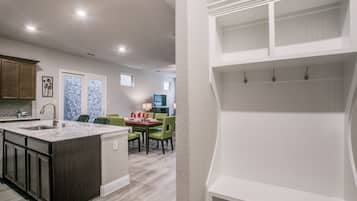 City Townhome | Private kitchen | Full-sized fridge, microwave, oven, dishwasher