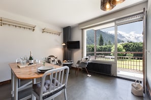 Dining area with access to a sunny balcony