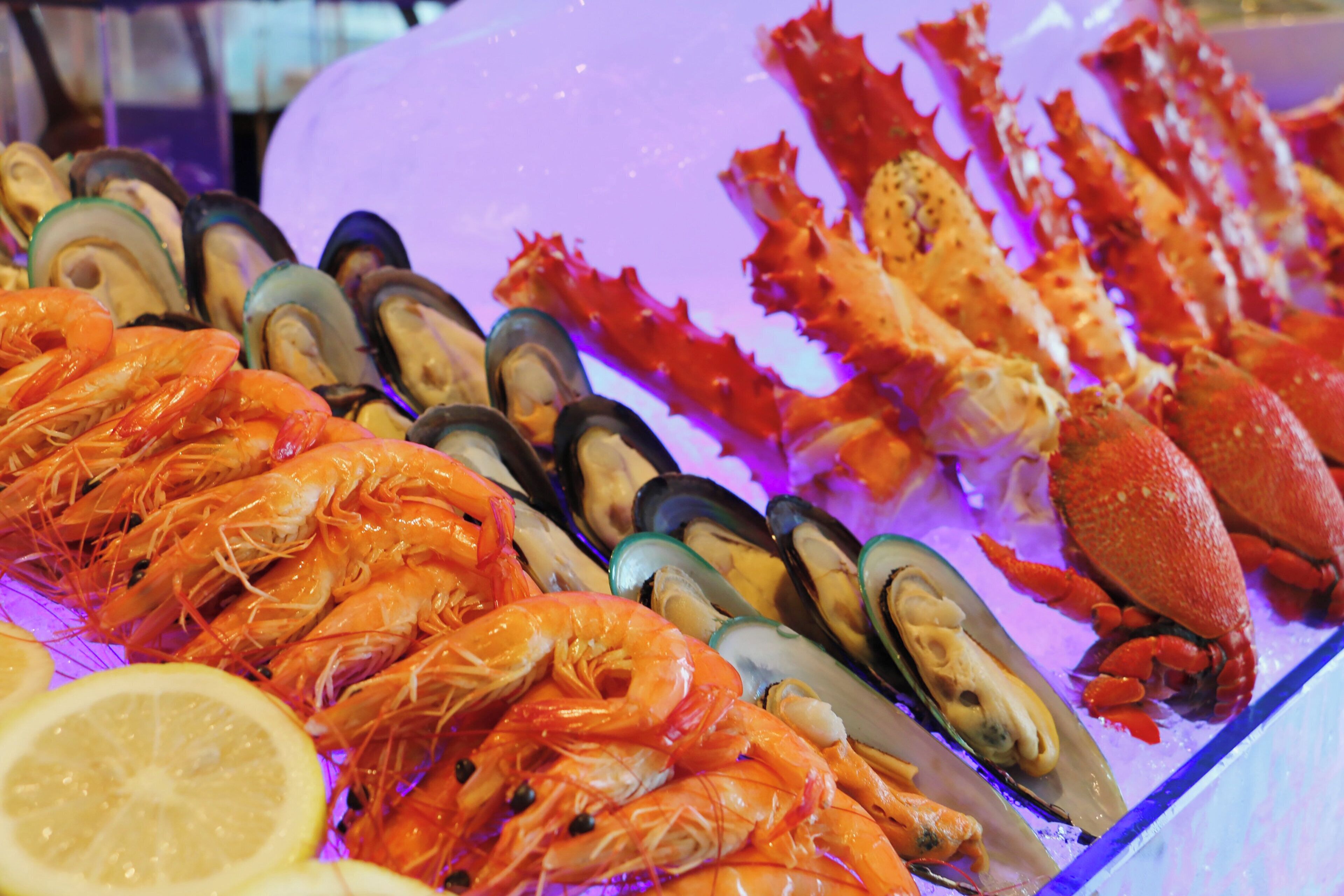 A seafood display with shrimp, mussels, and lobster.