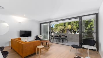Signature Apartment, 3 Bedrooms, Balcony | Living room | 50-inch flat-screen TV with digital channels, Smart TV