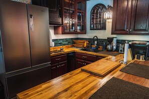 Fridge, microwave, stovetop, coffee/tea maker