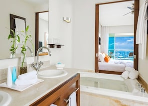 Enjoy a refreshing soak in the bathtub or take in the ocean views from the balcony.