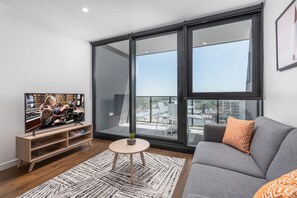 Deluxe Apartment, 2 Bedrooms | Living area | 42-inch flat-screen TV with satellite channels, TV