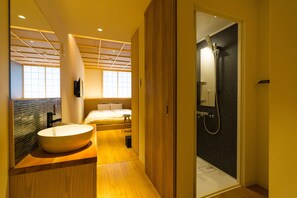 A modern bathroom with a large sink, a shower, and a bed. - lili kyoto (Kyoto)