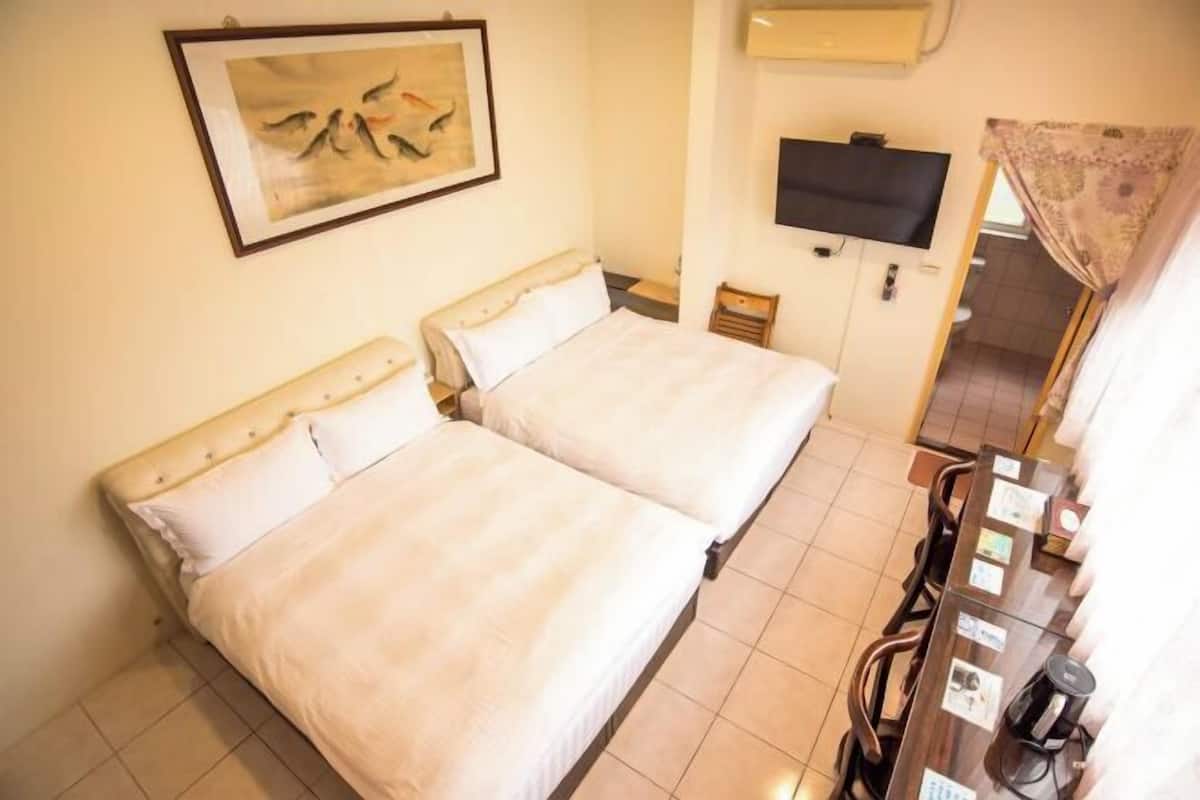 Desk, laptop workspace, free WiFi, bed sheets