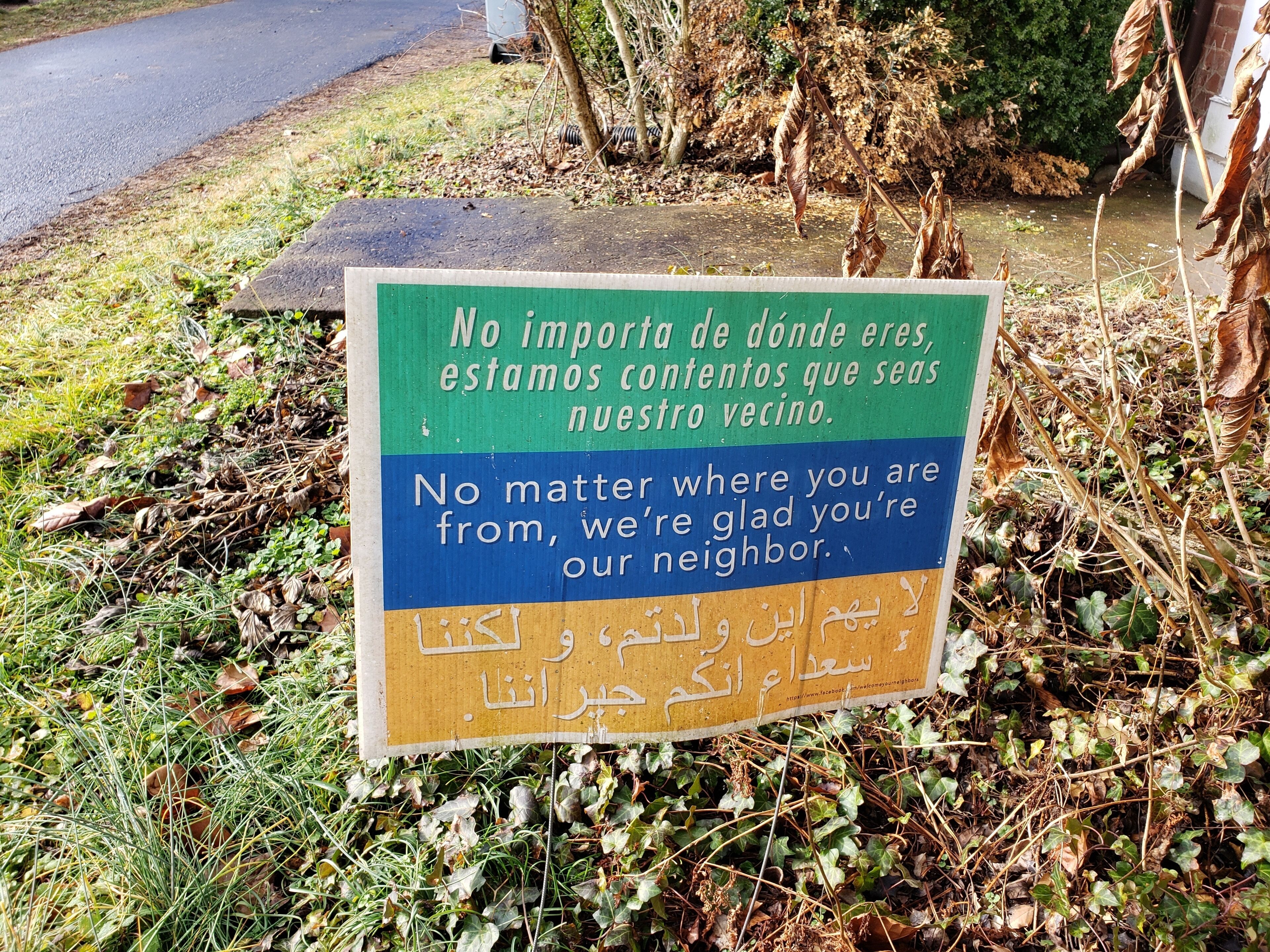 A sign with a message in multiple languages.