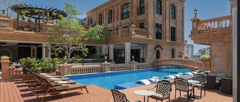 Outdoor pool, open 7:00 AM to 7:00 PM, free cabanas, pool umbrellas