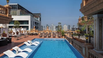 Outdoor pool, open 7:00 AM to 7:00 PM, free pool cabanas, pool umbrellas