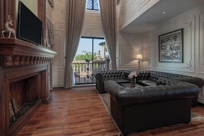 Penthouse | Living area | 50-inch Smart TV with satellite channels