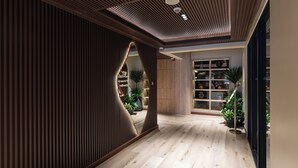 A modern interior with a wooden floor, a slatted wall, and a bookshelf with plants.