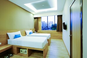 Premium Twin Room | In-room safe, desk, laptop workspace, iron/ironing board - deSatu Hotel (Medan)
