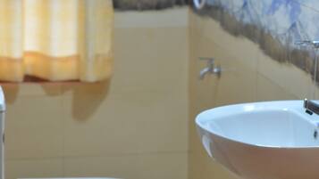 Shower, free toiletries, slippers, towels