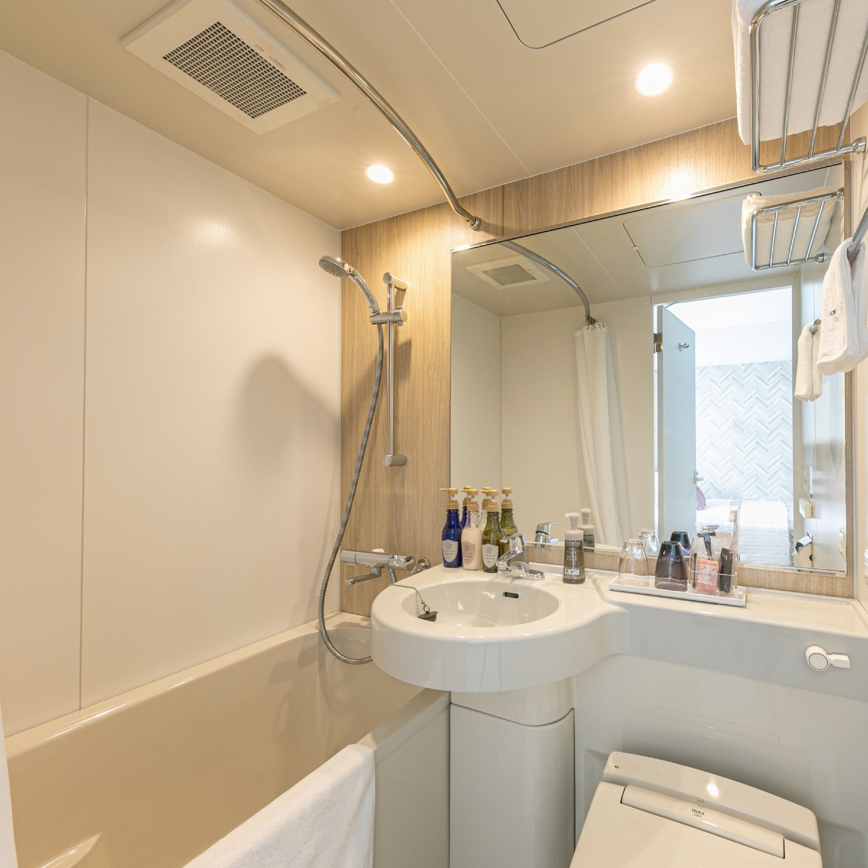 combined shower/bathtub, free toiletries, hair dryer, bathrobes