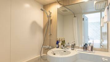 Combined shower/tub, free toiletries, hair dryer, bathrobes