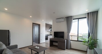 Apartamento | Sala de estar | Una televisión de pantalla plana
