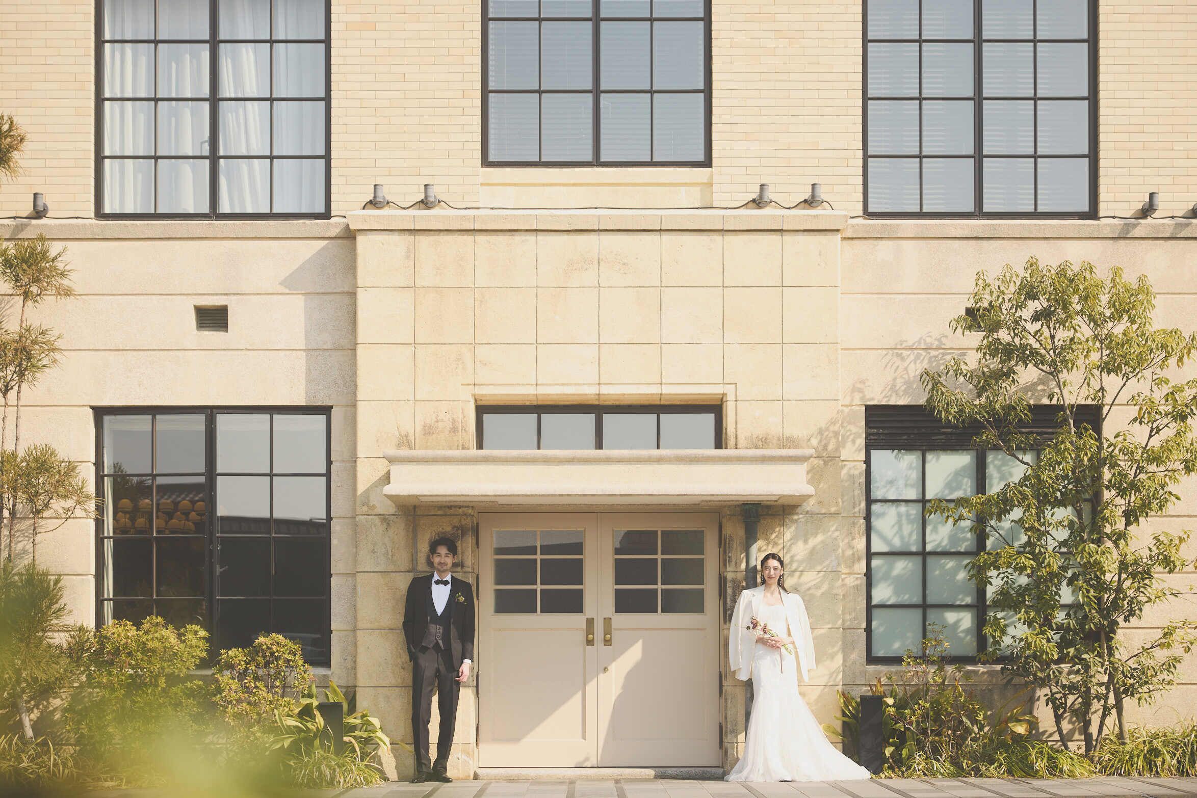 A building facade with large windows and a central entrance.