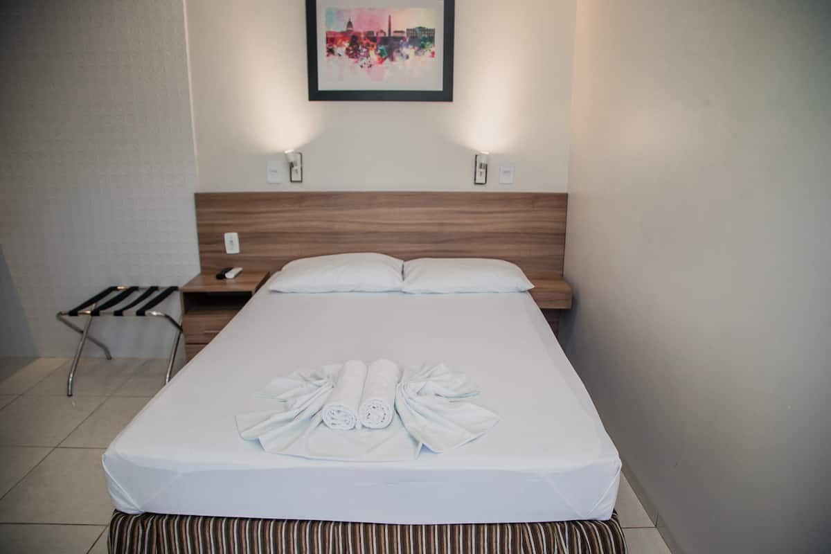 Desk, laptop workspace, blackout drapes, iron/ironing board