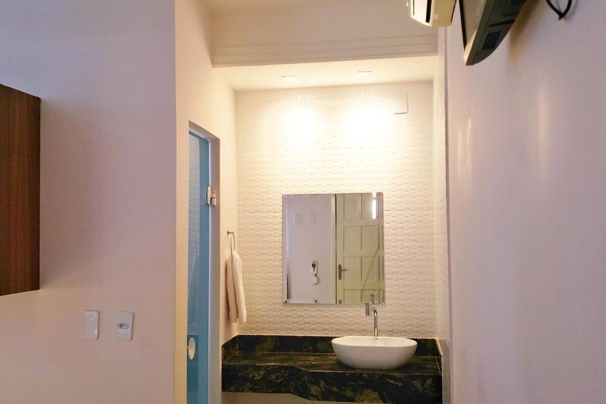 desk, laptop workspace, blackout curtains, iron/ironing board