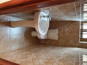 Shower, towels, soap, toilet paper