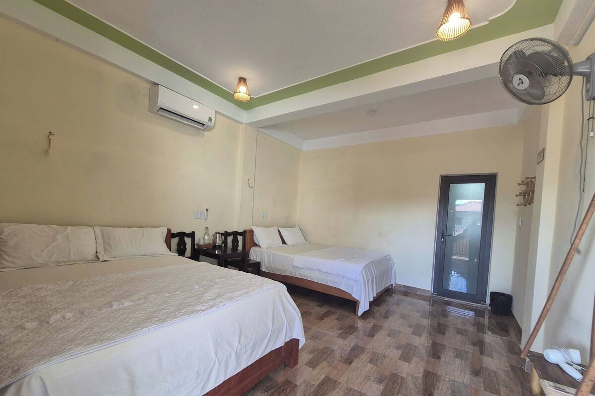 Panoramic Quadruple Room, 2 Queen Beds, Mountain View | Desk, laptop workspace, blackout drapes, soundproofing