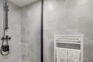 Shower, hair dryer, towels, soap