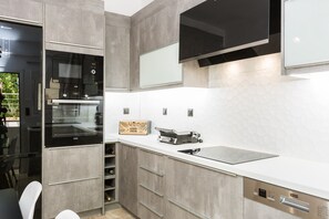 Comfort Apartment | Private kitchen | Fridge, stovetop