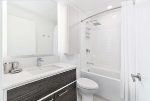 Combined shower/bathtub, hair dryer, towels