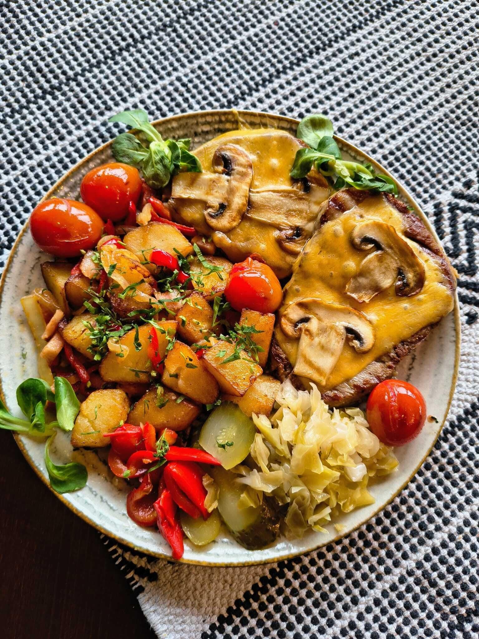 A plate of food with various vegetables and mushrooms.