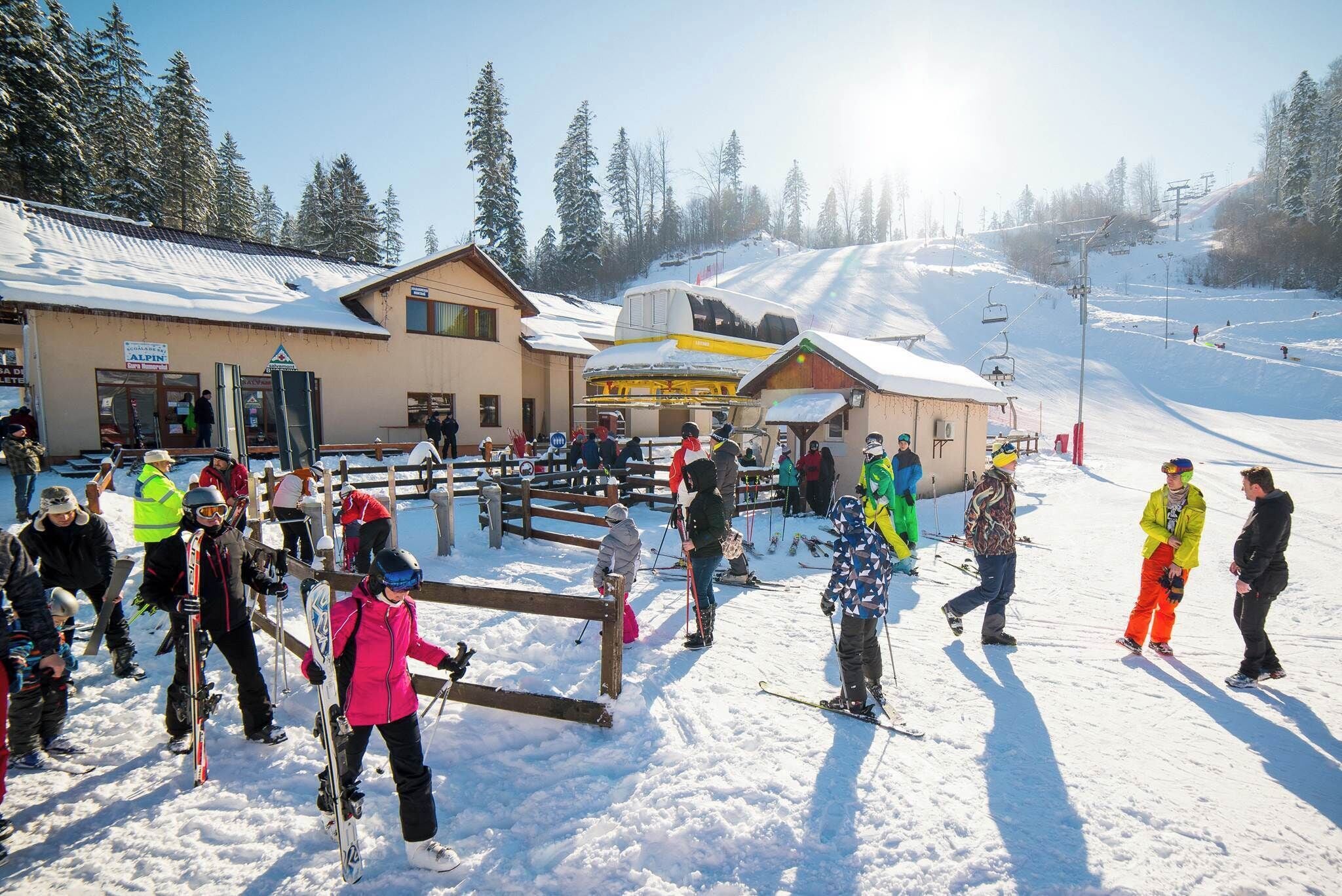 A ski resort with a building that has a sign reading "ALPIN".