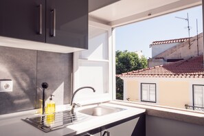 Fridge, microwave, stovetop, coffee/tea maker