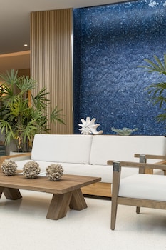 Sitting area in hotel lobby at Opal Grand Oceanfront Resort & Spa