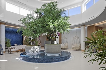 Hotel entrance and lobby at Opal Grand Oceanfront Resort & Spa