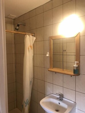Shower, towels, soap, toilet paper