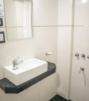 Shower, rainfall showerhead, bidet, towels