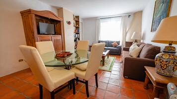 Deluxe Villa | Living room | 40-inch flat-screen TV with digital channels, TV, fireplace