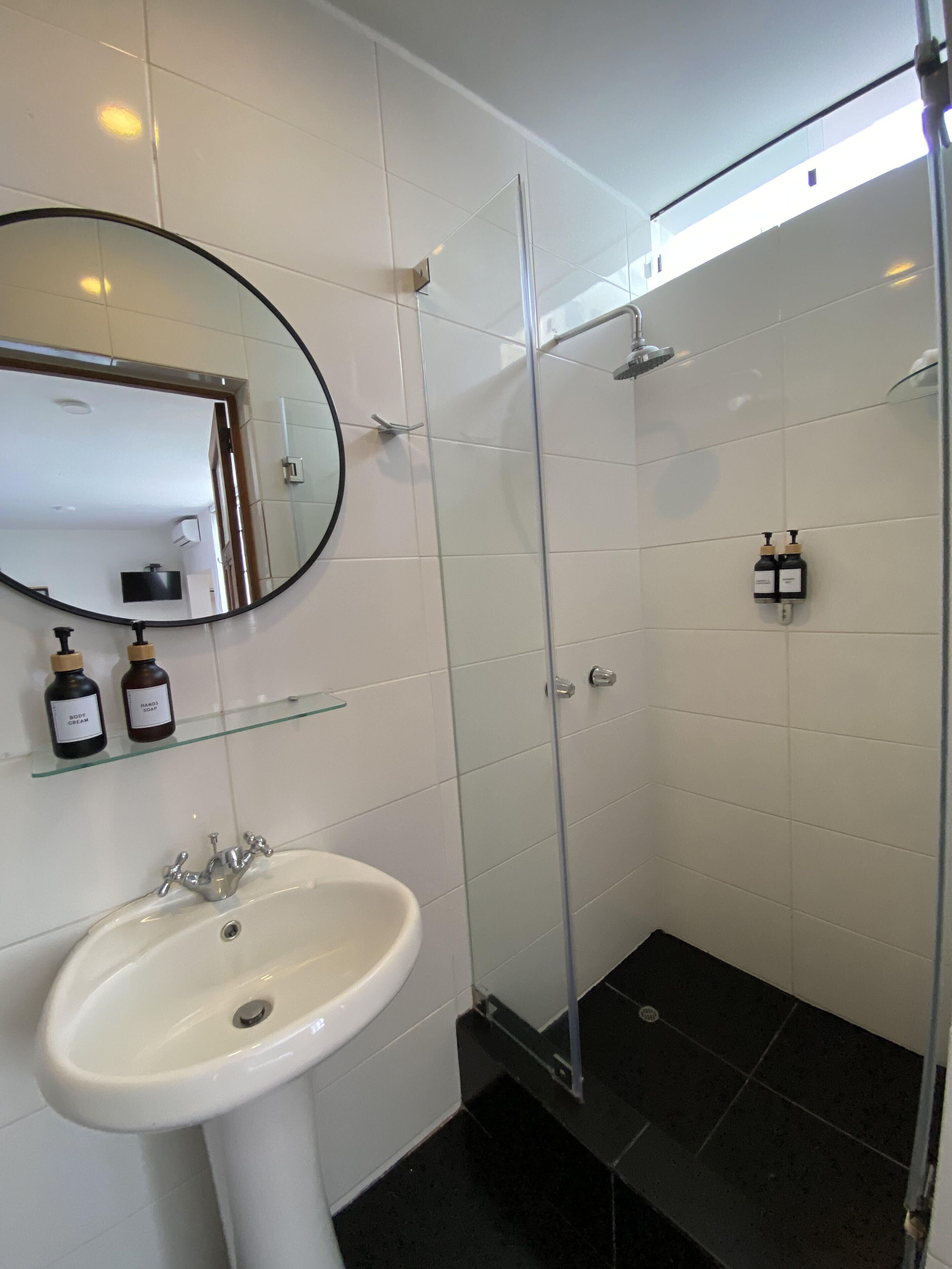superior studio suite, garden view | bathroom | shower, rainfall showerhead, designer toiletries, hair dryer