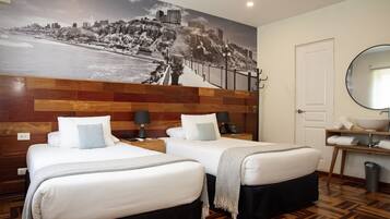 Luxe beddengoed, een kluis op de kamer, een laptopwerkplek