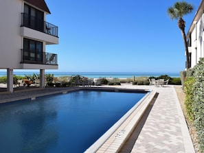 A heated pool - Waters Edge 110S · Direct Gulf Balcony · 1-Month Rental (Holmes Beach)