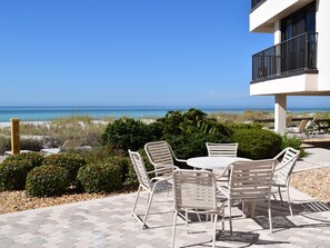 Outdoor dining - WE 110 Lovely Gulf Front 2/2 Pool Condo Relax On Sugar Sand Beach (Holmes Beach)