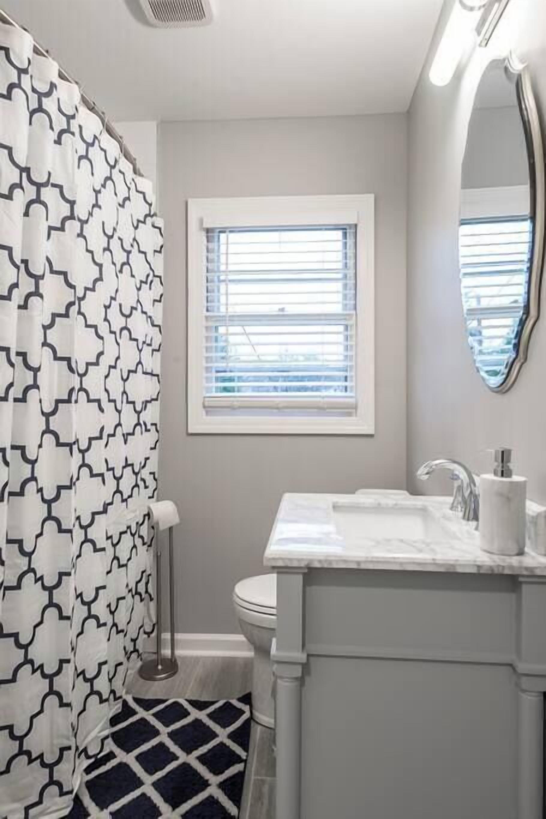 Bathtub, hair dryer, towels, shampoo